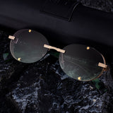 2025 New Oval Frameless Sunglasses European and American Retro Punk Sunglasses Stage Performance Fashion Street Beat Glasses